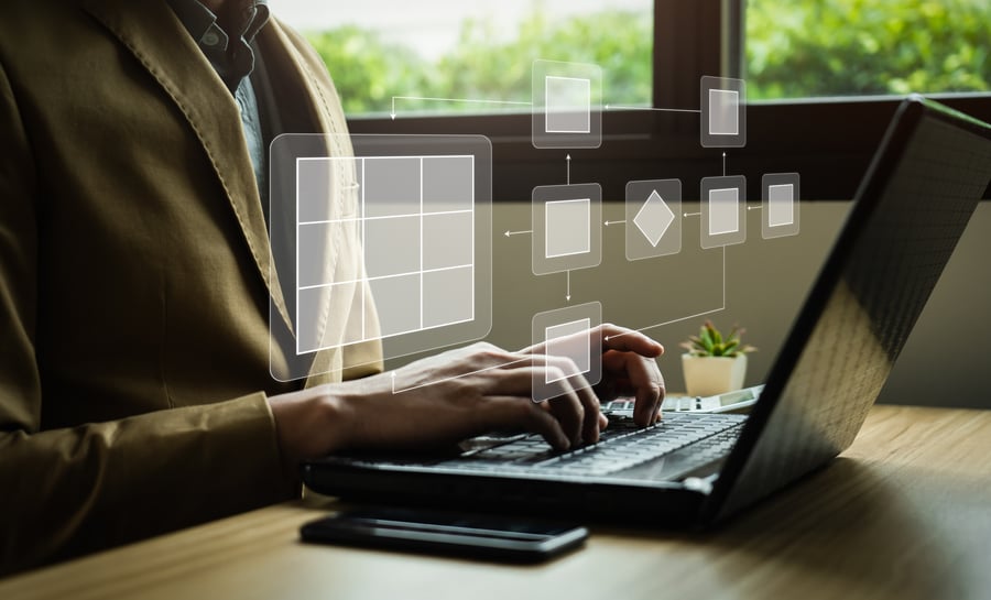 Person typing on computer showing digital workflow 